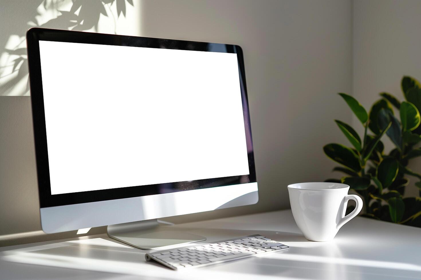 Computer Mockup on White Desk with Coffee Cup    and  Workspace Background photo