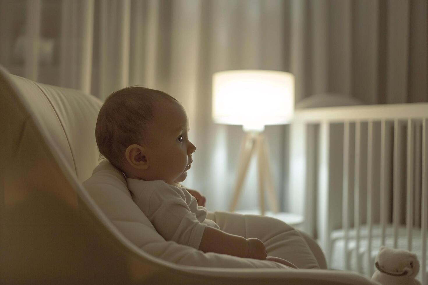 Baby in a nursery with  lines and design elements photo