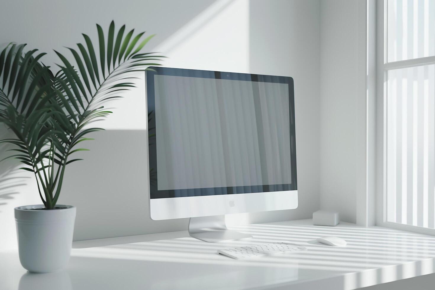 Computer mockup on a white desk with plant and  surface photo