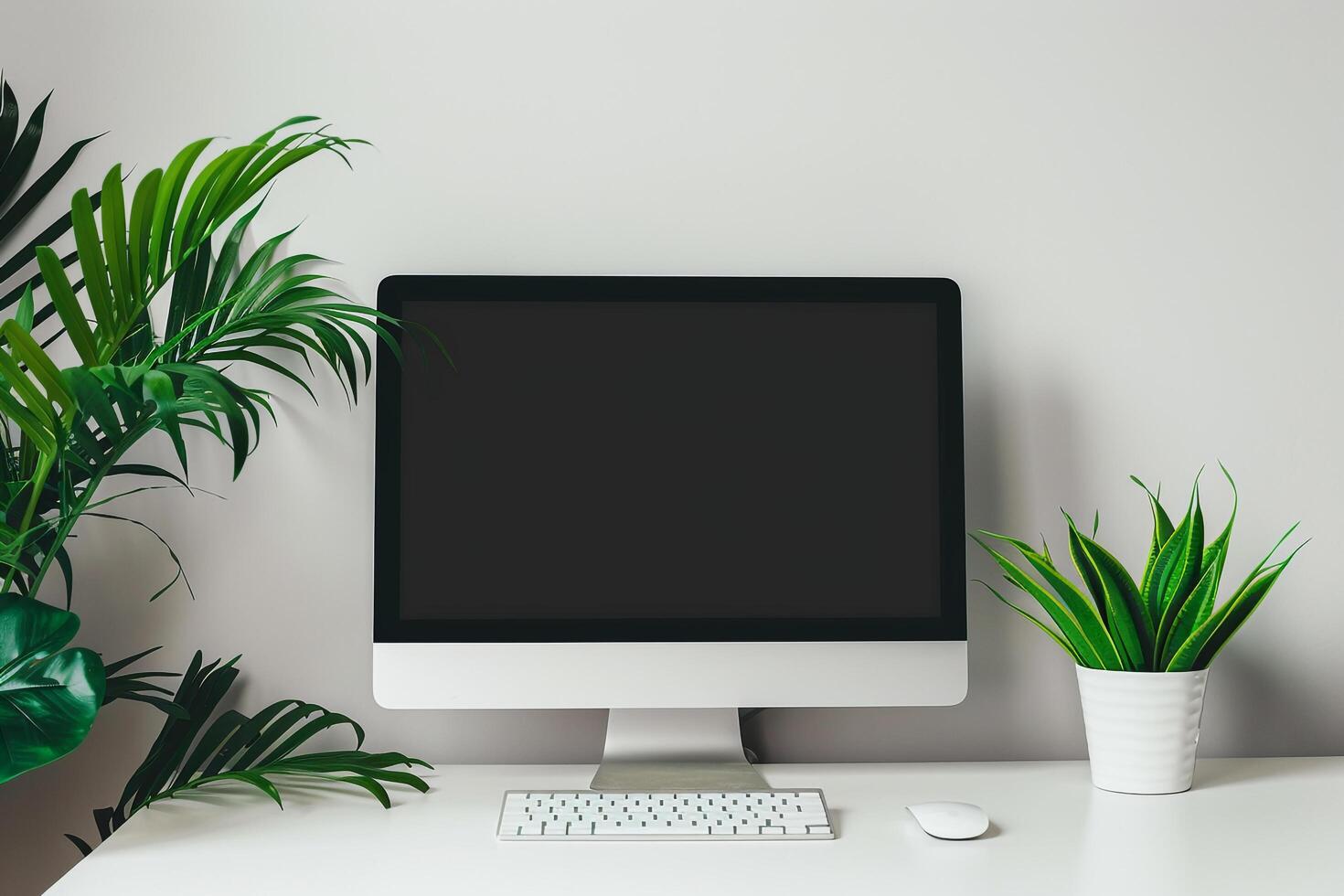 Computer mockup featuring a white desk and plant with a  setup photo