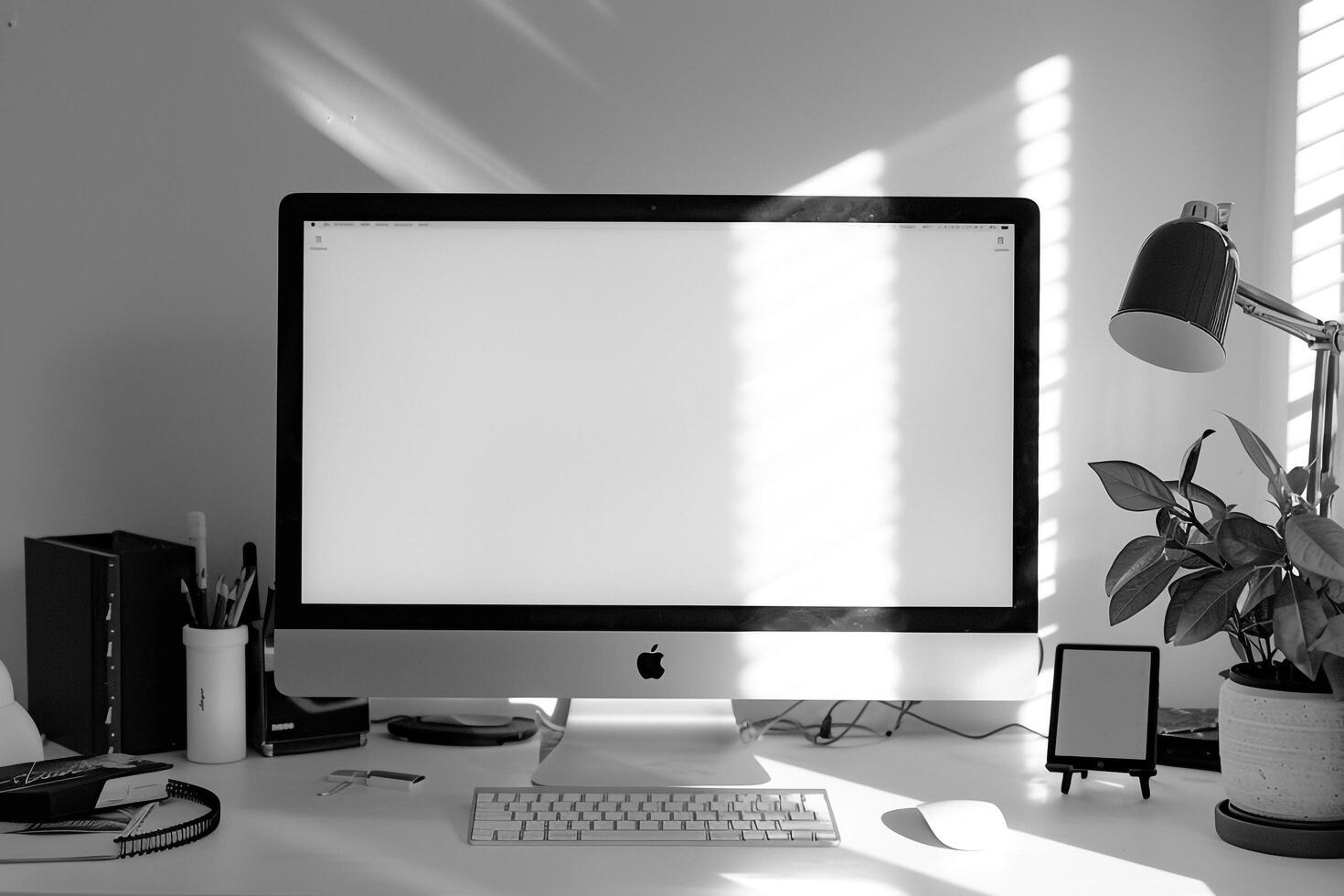 White Desk with Computer Mockup and Surrounding Writing Materials photo