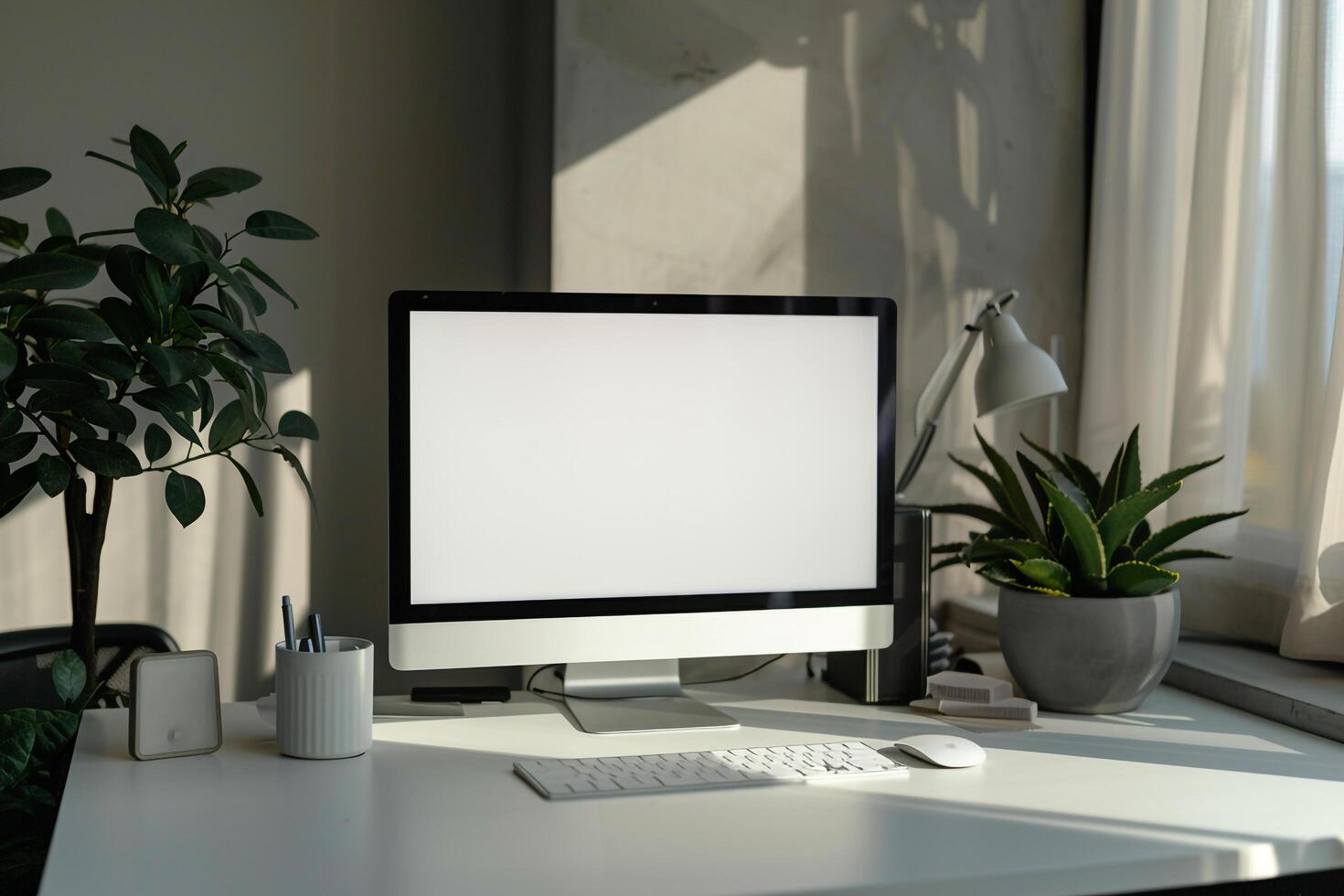 Computer Mockup with Writing Materials on a  White Desk photo