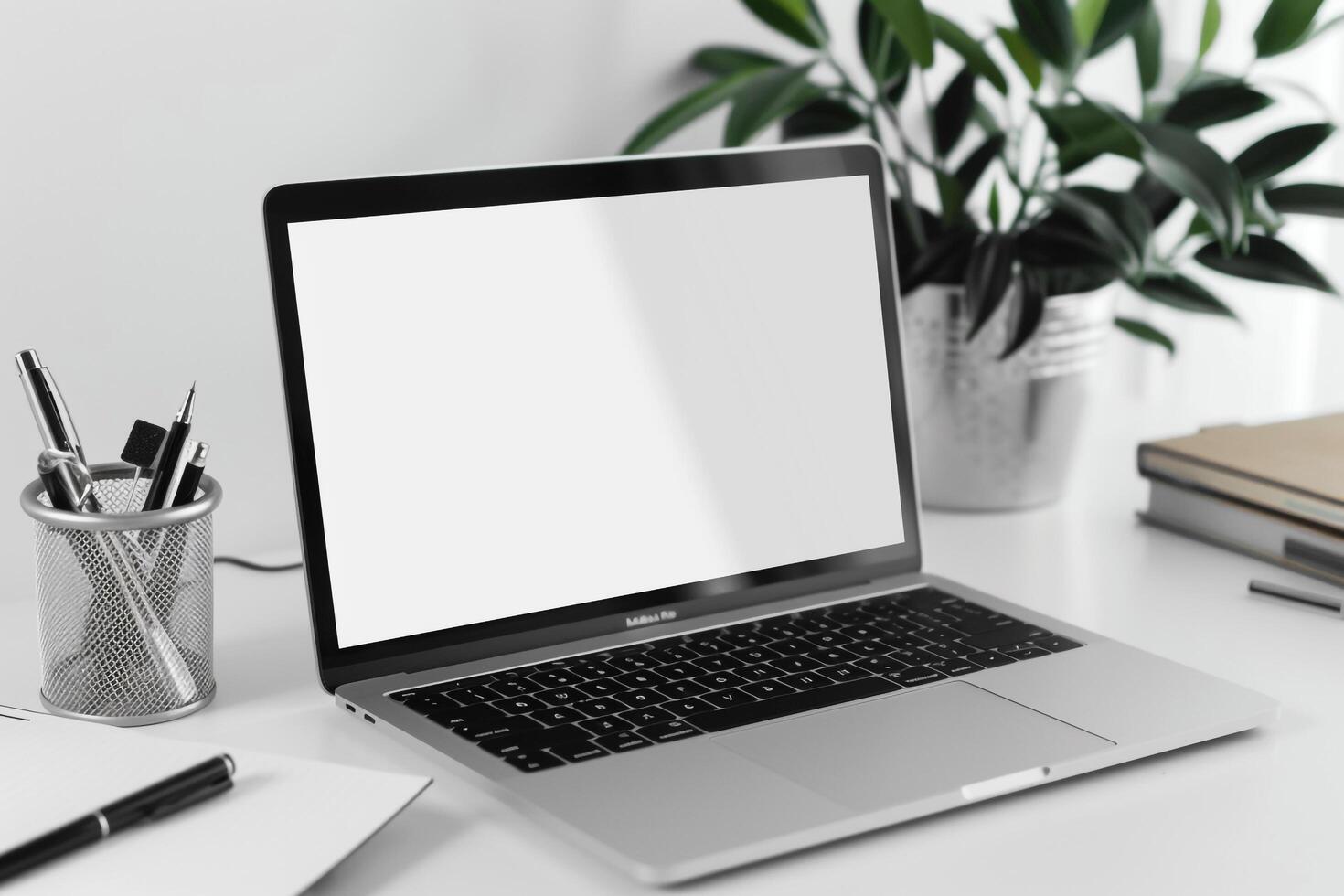 White Desk with Laptop Mockup Open Notebook and Writing Accessories photo