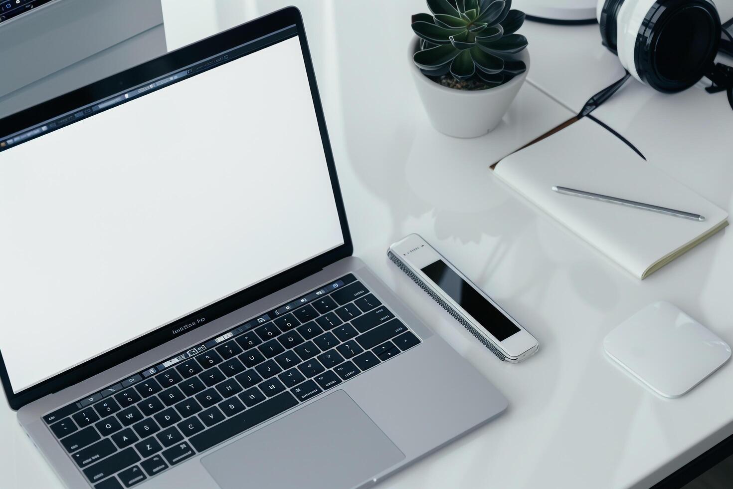 White Desk with Laptop Mockup Open Notebook and  Writing Materials photo