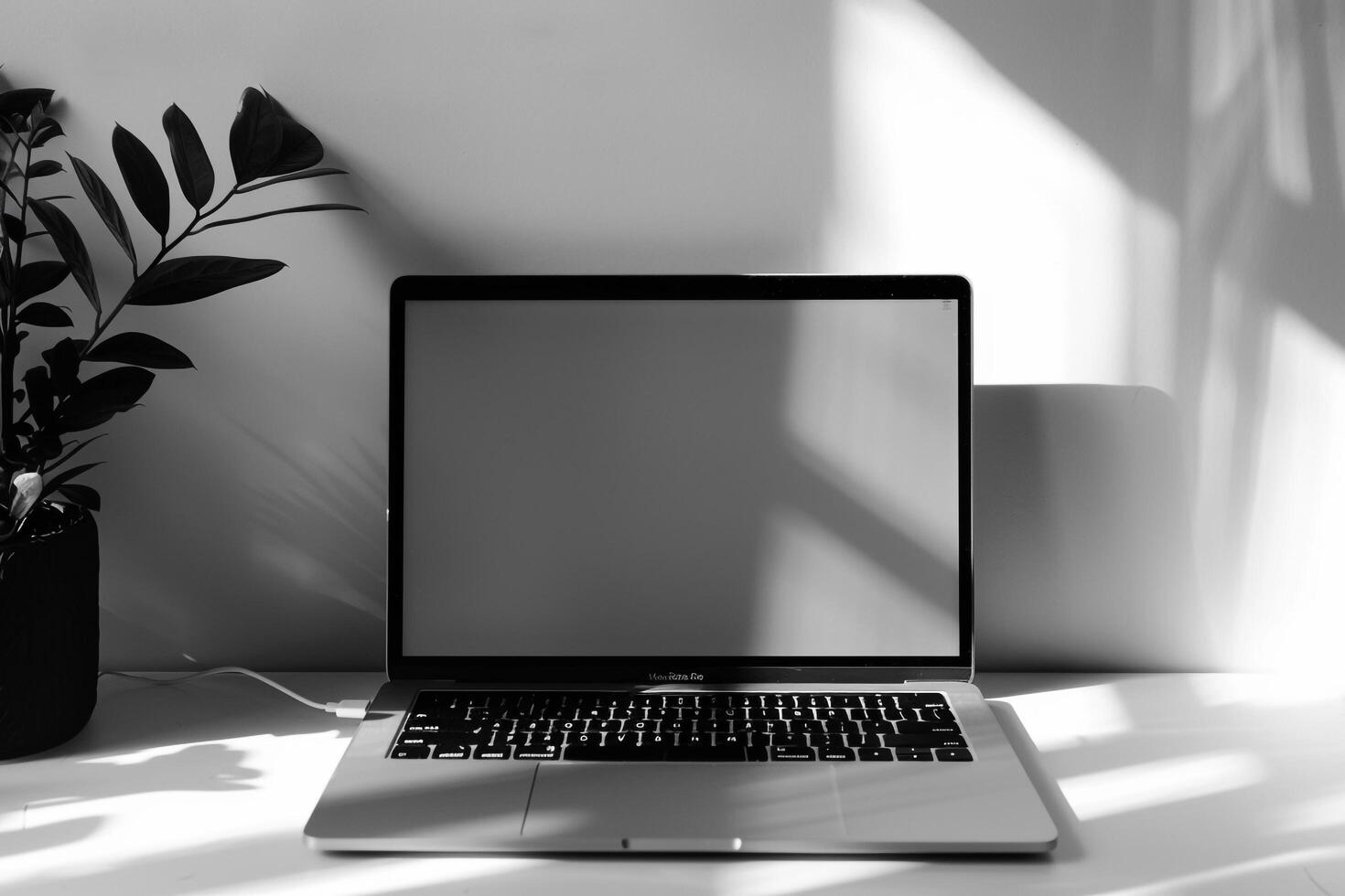 Laptop Mockup with Blank Notebook Open on White Desk photo