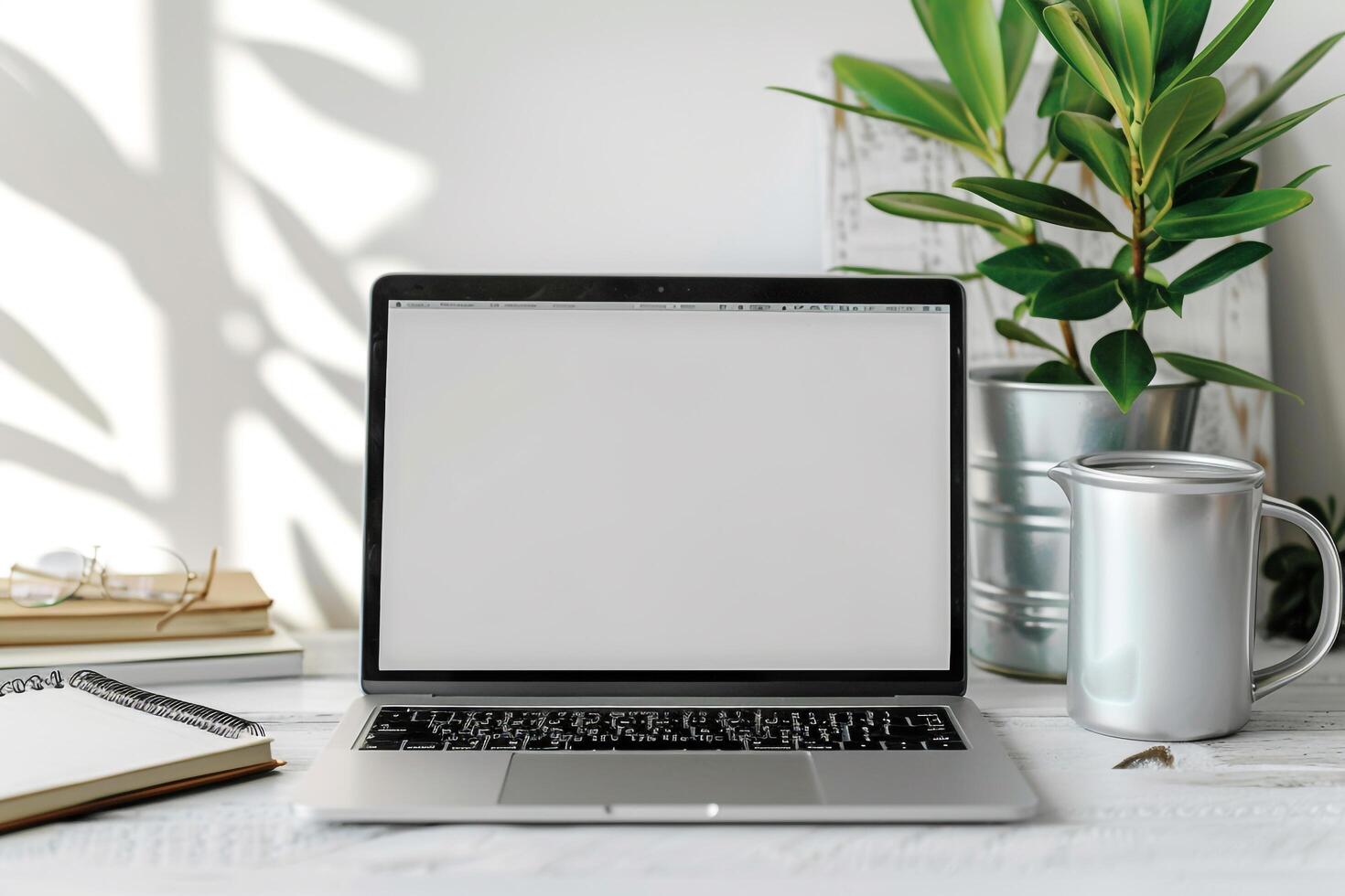 Laptop Mockup with Blank Notebook Open on White Desk photo