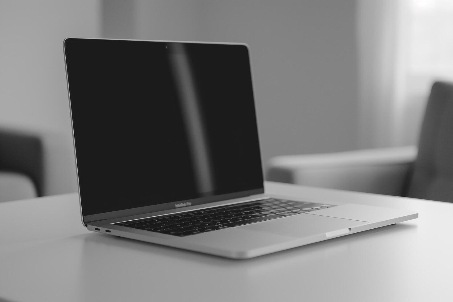 Laptop Mockup with Blank Notebook Open on White Desk photo