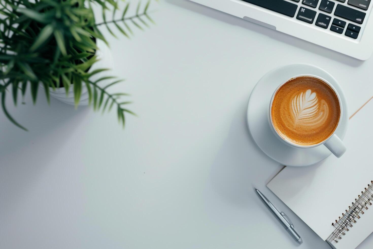 Laptop Mockup with Blank Notebook Open on White Desk photo