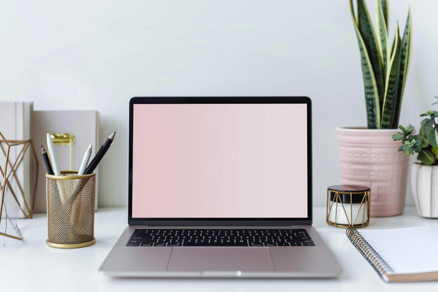 Laptop Mockup with Blank Notebook Open on White Desk photo
