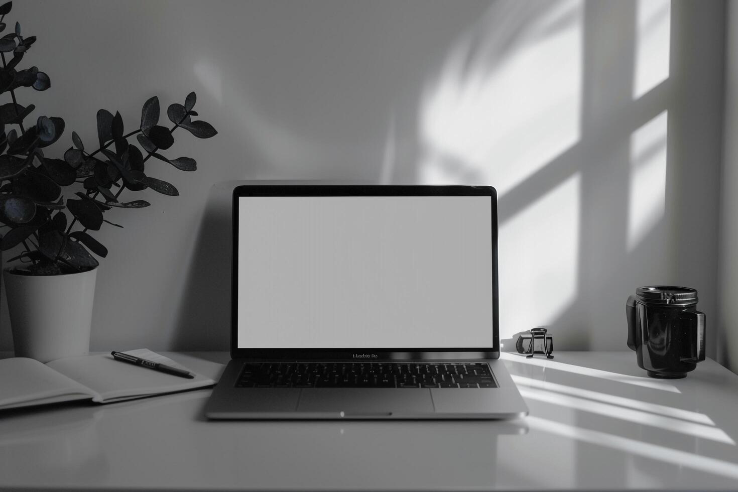 White Desk Background with Laptop Mockup and Open Notebook for   Work and Writing photo