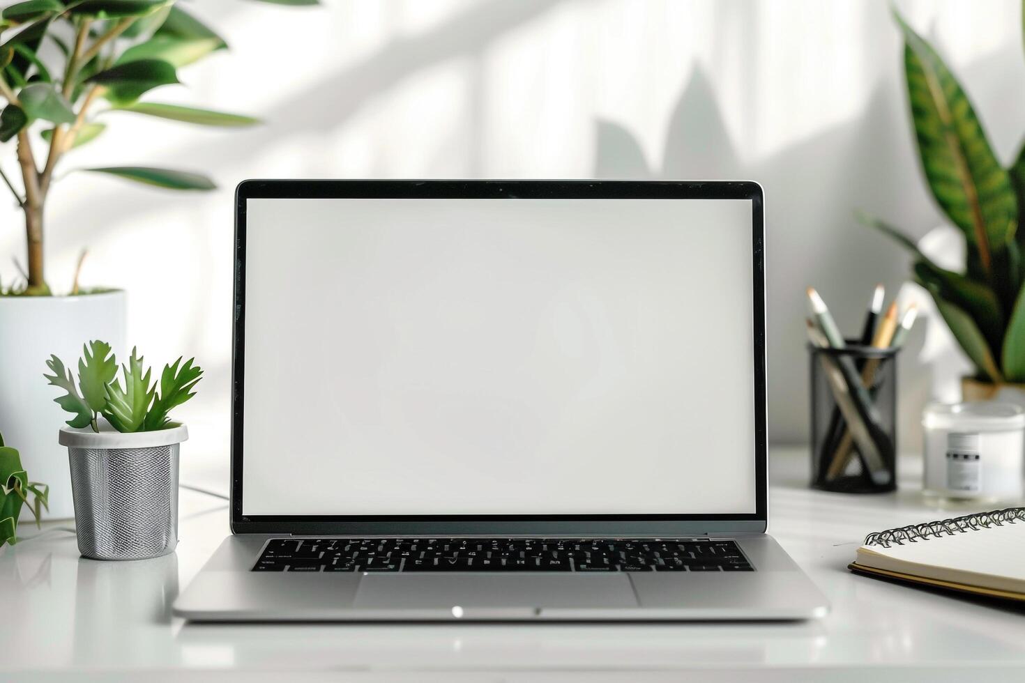 Writing and Work Setup with Laptop Mockup and Open Notebook on White Desk Background photo