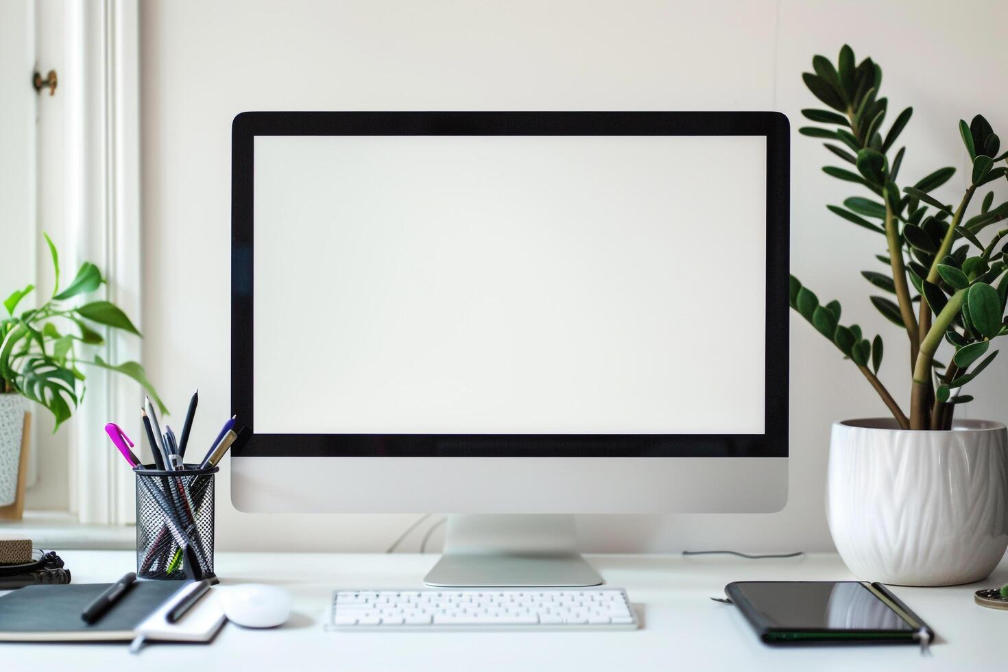 Computer Mockup with Notebooks and Pens on White Desk for Writing and Editing photo