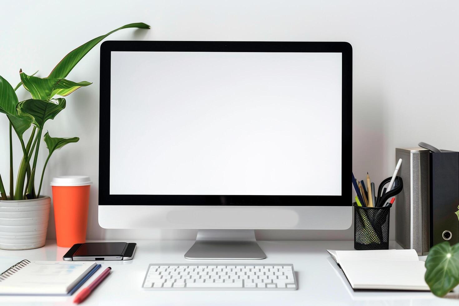 Computer Mockup with Notebooks and Pens on White Desk for Writing and Editing photo