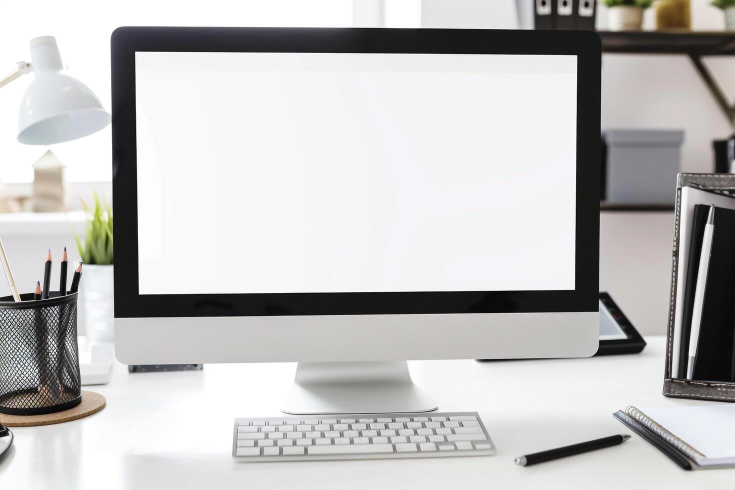 Computer Mockup with Notebooks and Pens on White Desk for Writing and Editing photo