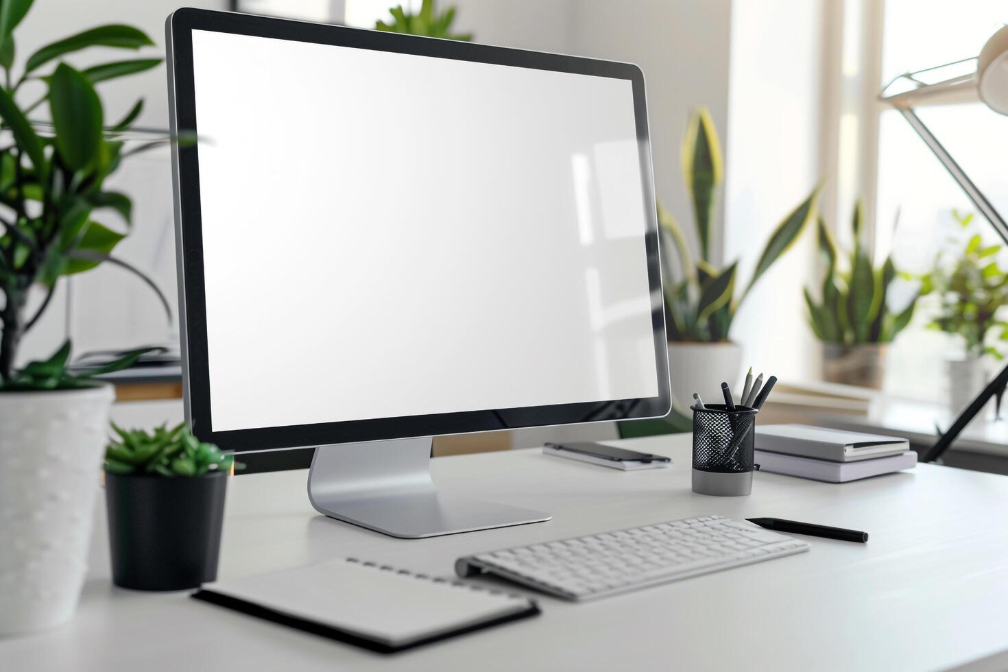 Computer Mockup with Notebooks and Pens on White Desk for Writing and Editing photo