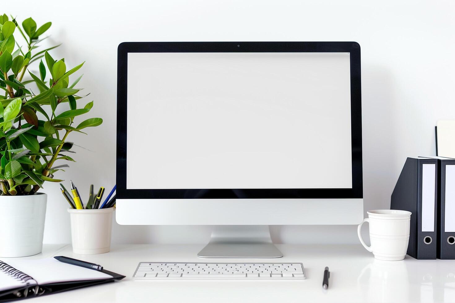 Computer Mockup with Notebooks and Pens on White Desk for Efficient Writing and Editing photo