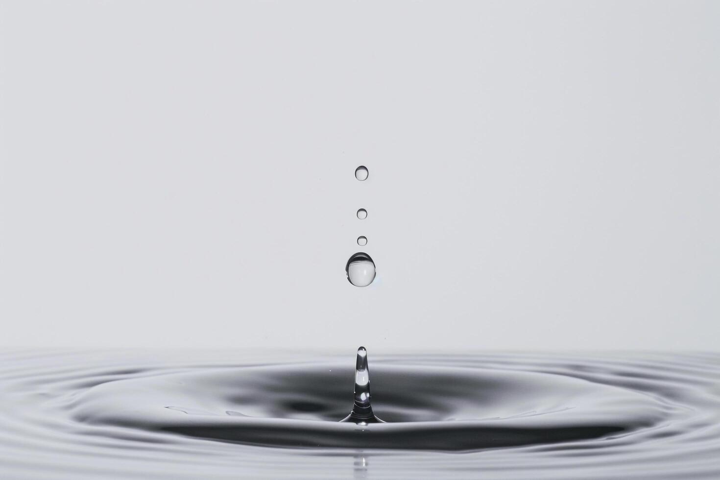 Single Water Droplet Impacting the Surface of a Pool with High Speed Precision photo
