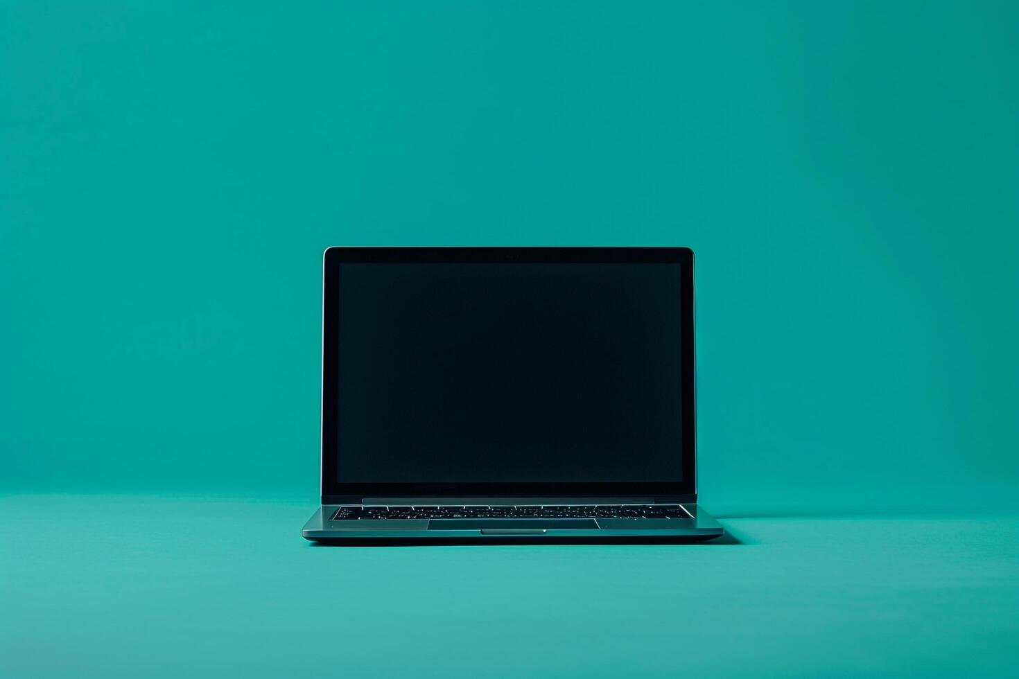 Laptop Mockup Against Teal Background for E Learning and Online Course Platforms photo