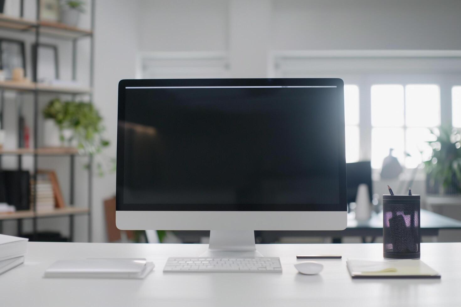 Sleek Computer Mockup Featuring Marketing Materials on White Desk photo