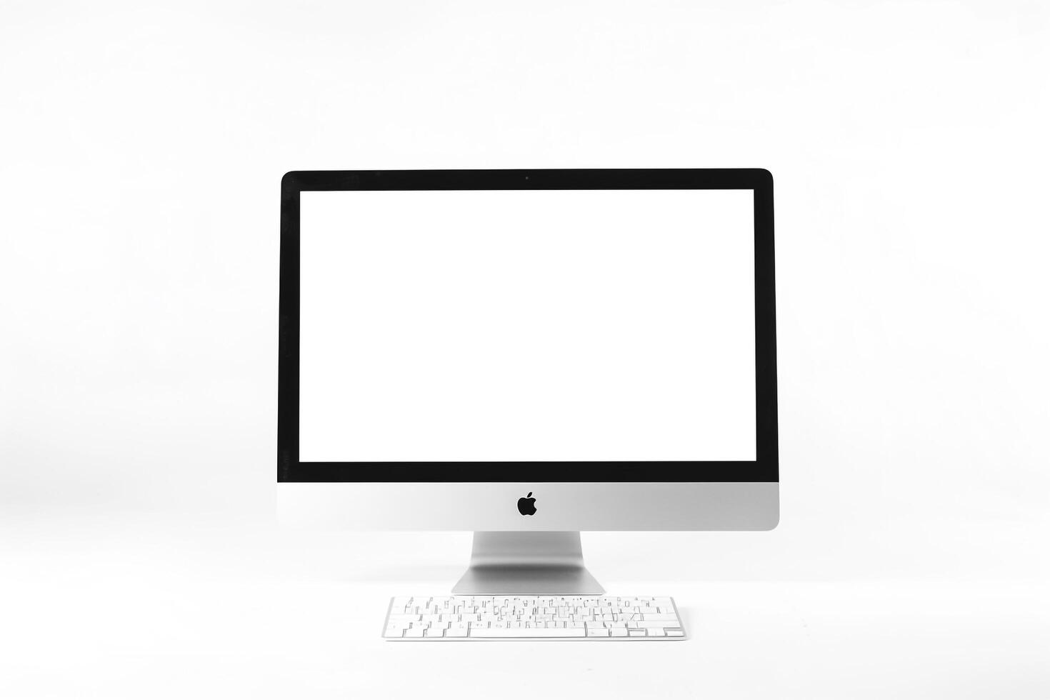 Computer Monitor Mockup with White Screen on Glossy Surface photo