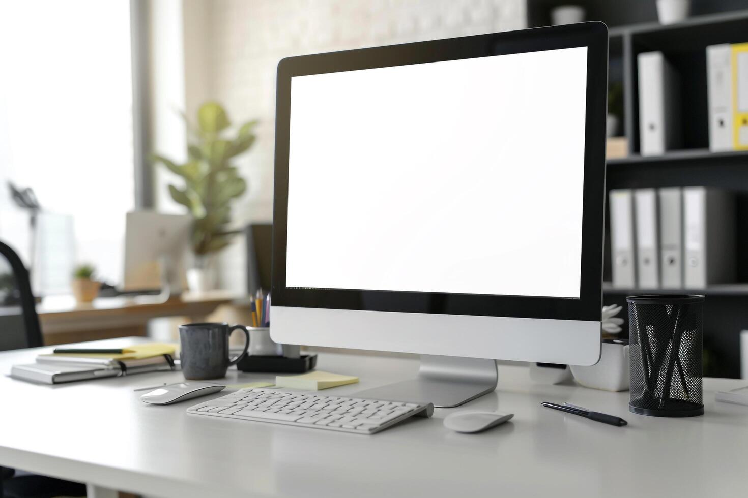Computer Mockup on White Desk with Marketing Materials photo