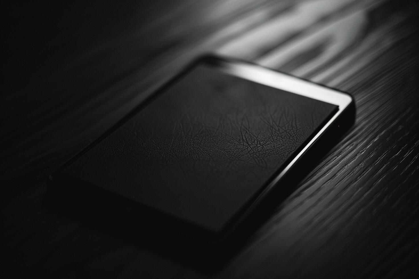 Noir Tablet Mockup with Glossy Black Surface and High Contrast s photo