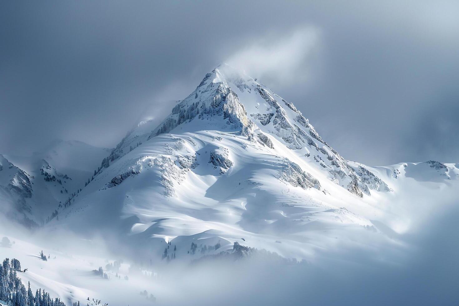 Snow Capped Mountain Peak with a Dramatic Cloudy Sky and Majestic Winter Landscape photo