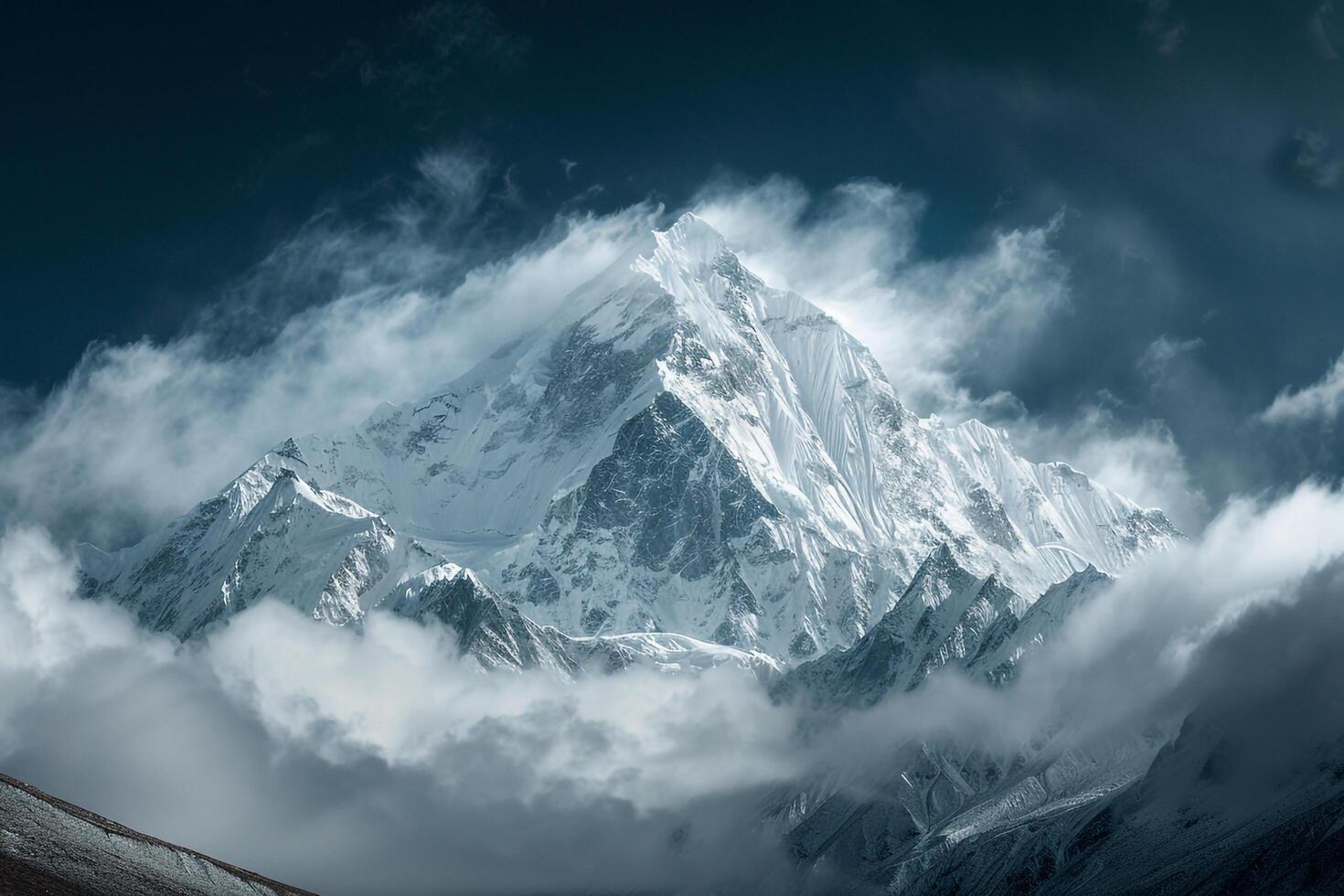 Snow Capped Mountain Peak with Dawn Mist in a Majestic Winter Landscape and Scenic photo
