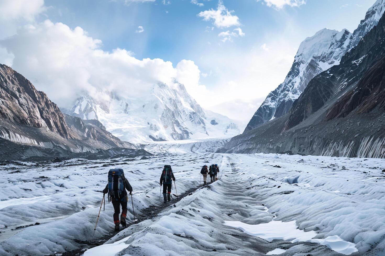 Mountaineers Traversing a Glacier with Towering Peaks in a Scenic Alpine Landscape photo