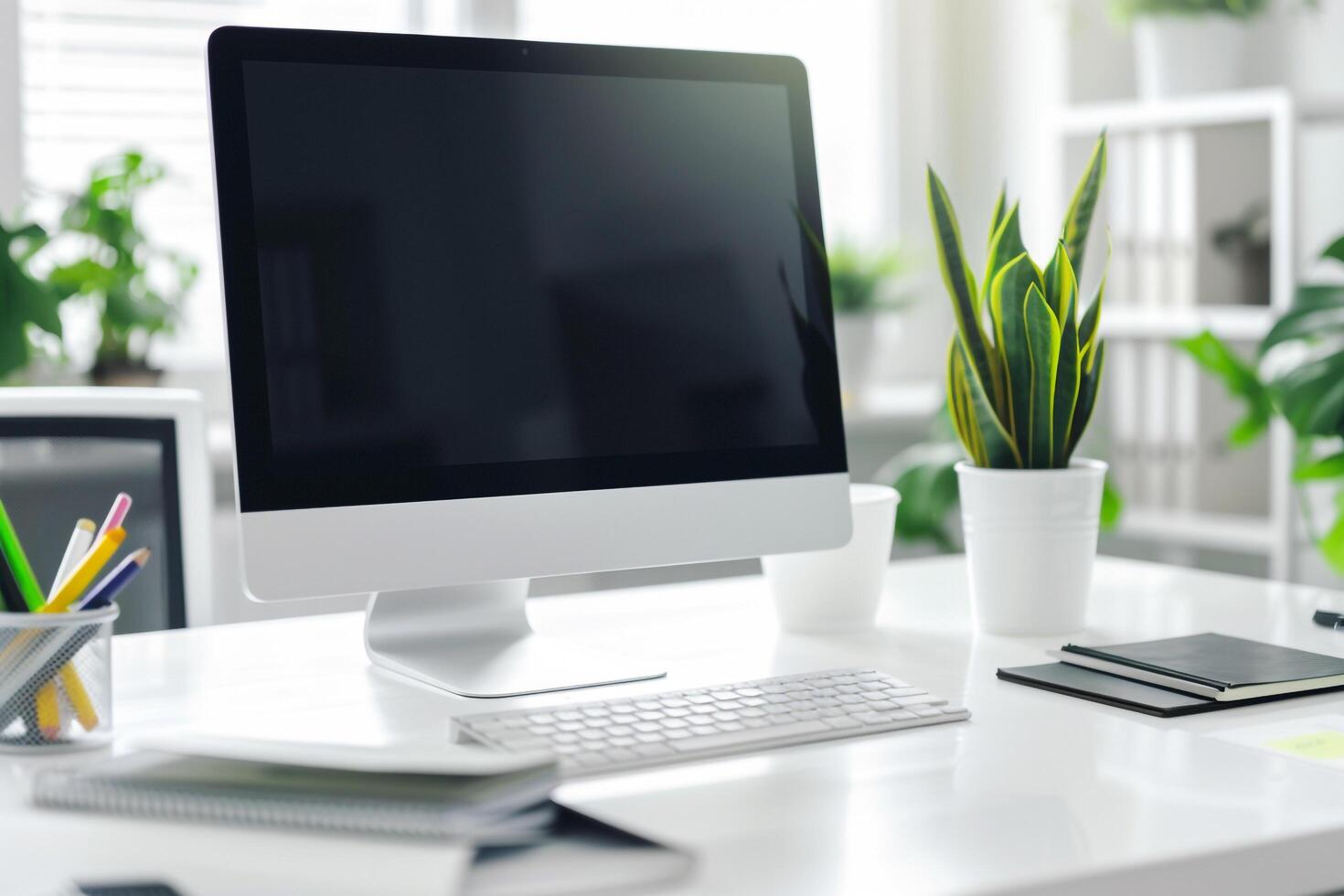 Computer Mockup Screen and Meeting Notes on White Desk photo