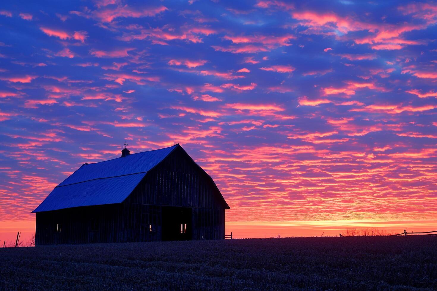 Rustic Farm Barn with Sunset Horizon Over Meadow photo