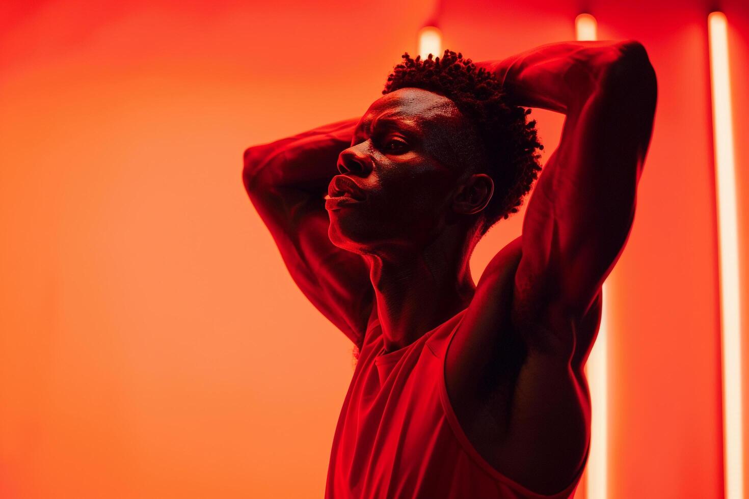 Man in Sportswear with Intense Red Background photo