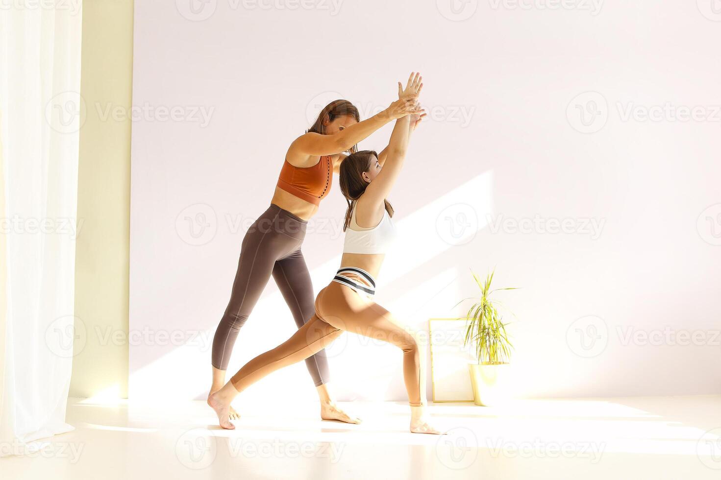 Women practicing yoga at home photo