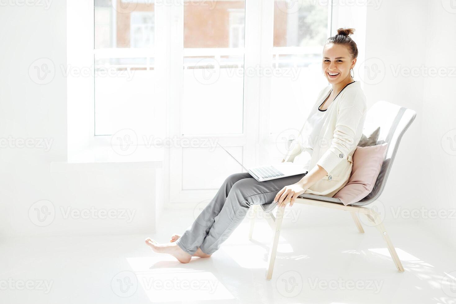 Young woman resting with laptop photo