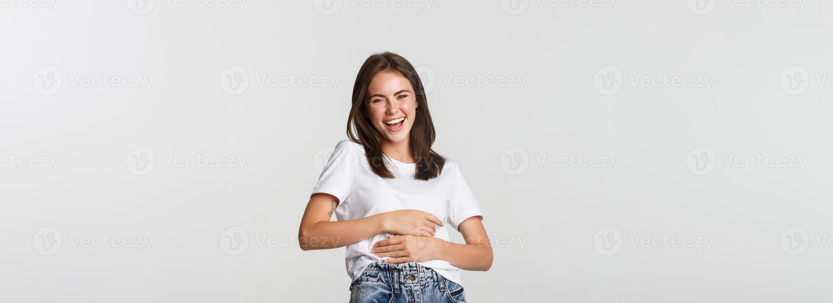 Happy beautiful woman laughing at something funny photo