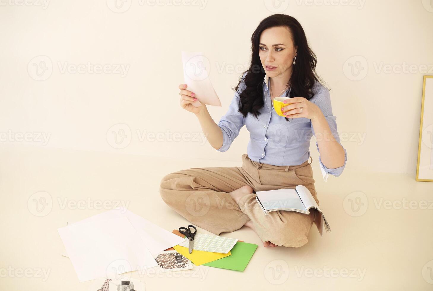 Young brunette woman creating her Feng Shui wish map. Dreams and wishes photo