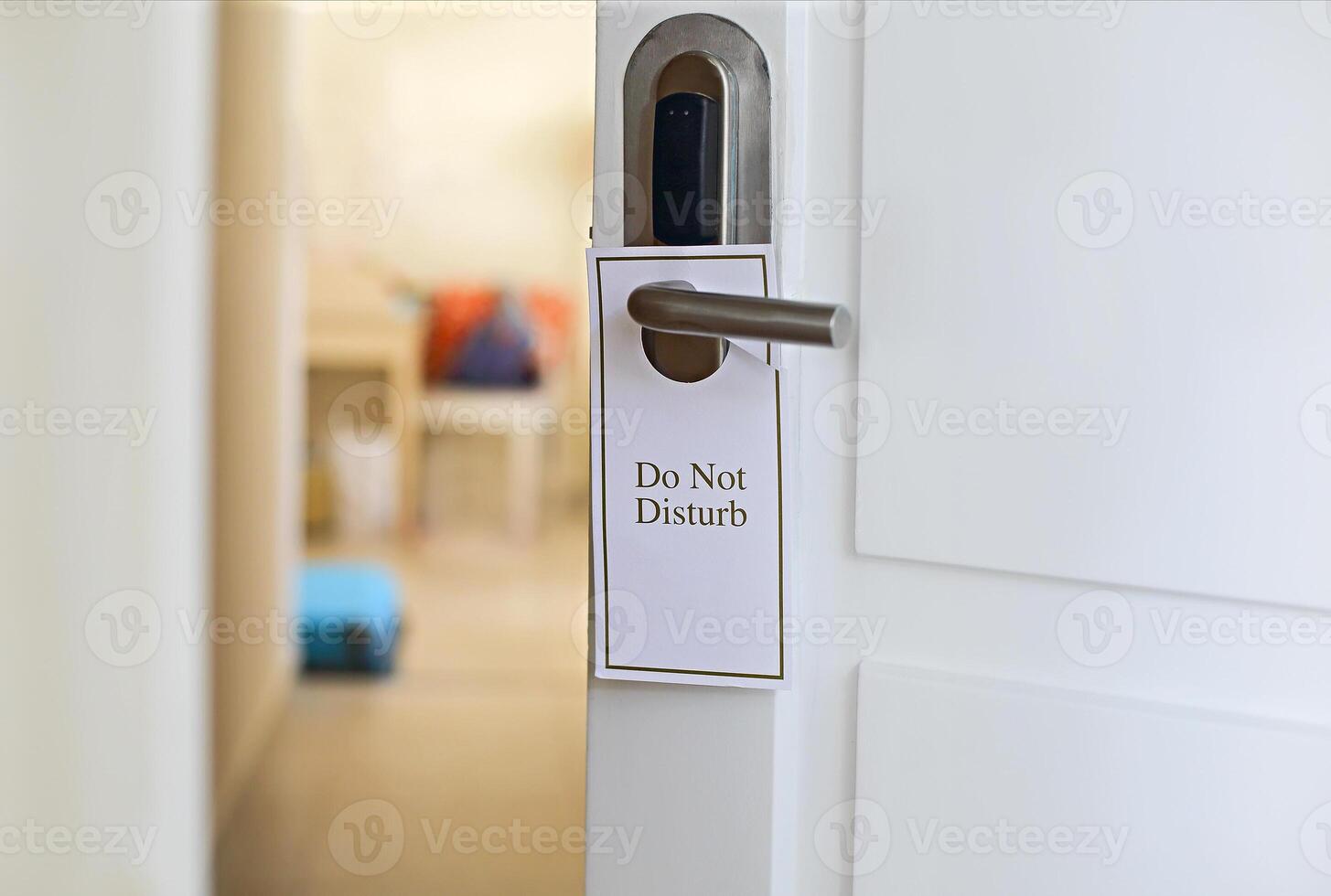 Do Not Disturb sign on hotel room's door photo