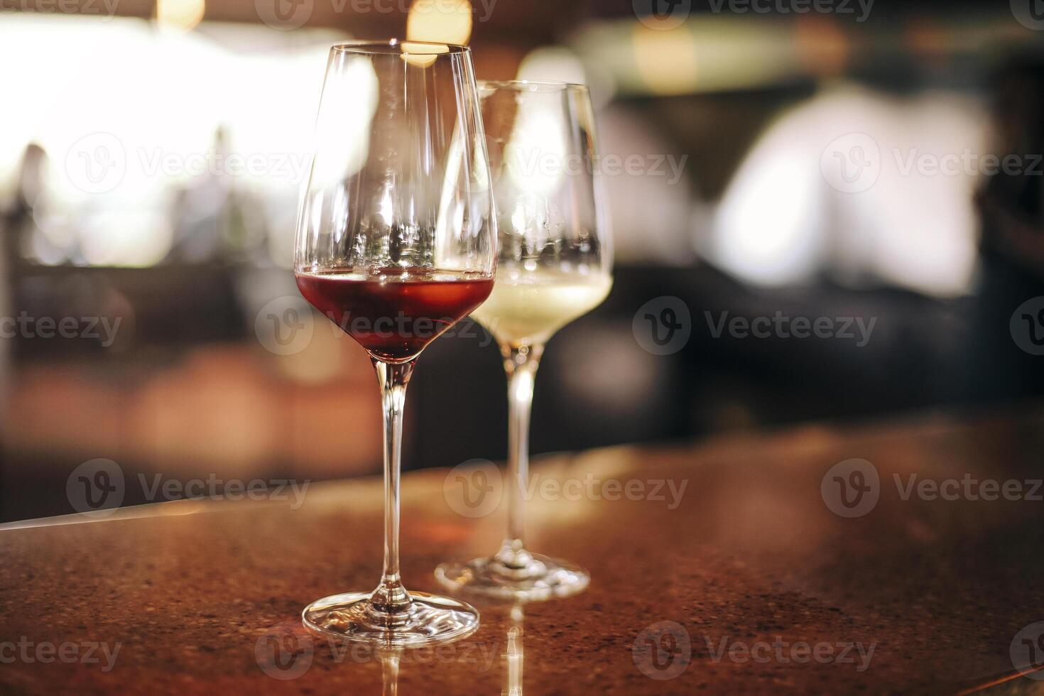 Wine bottle and glasses on the table, against the background of wine dinner. photo