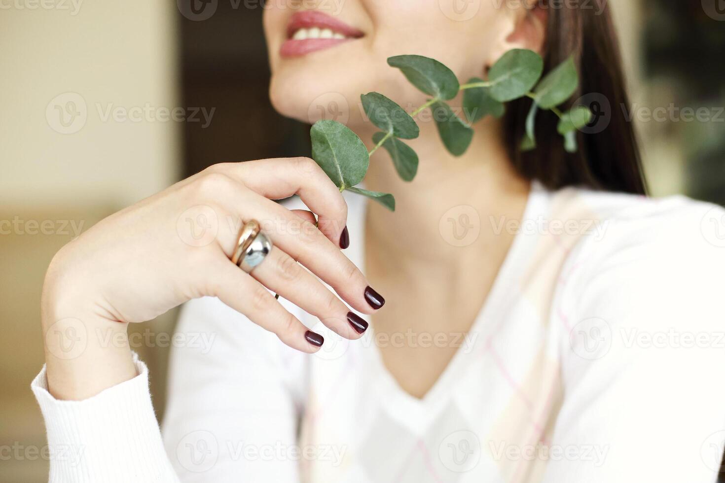 Crop woman with plant twig photo