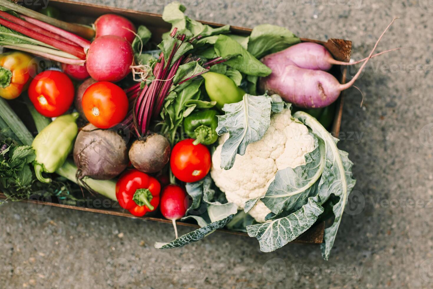 Pile of assorted vegetables in box photo