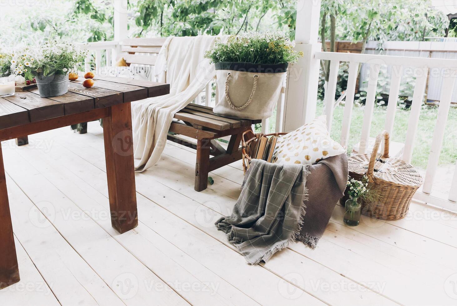 Cozy veranda with bench and flowers photo
