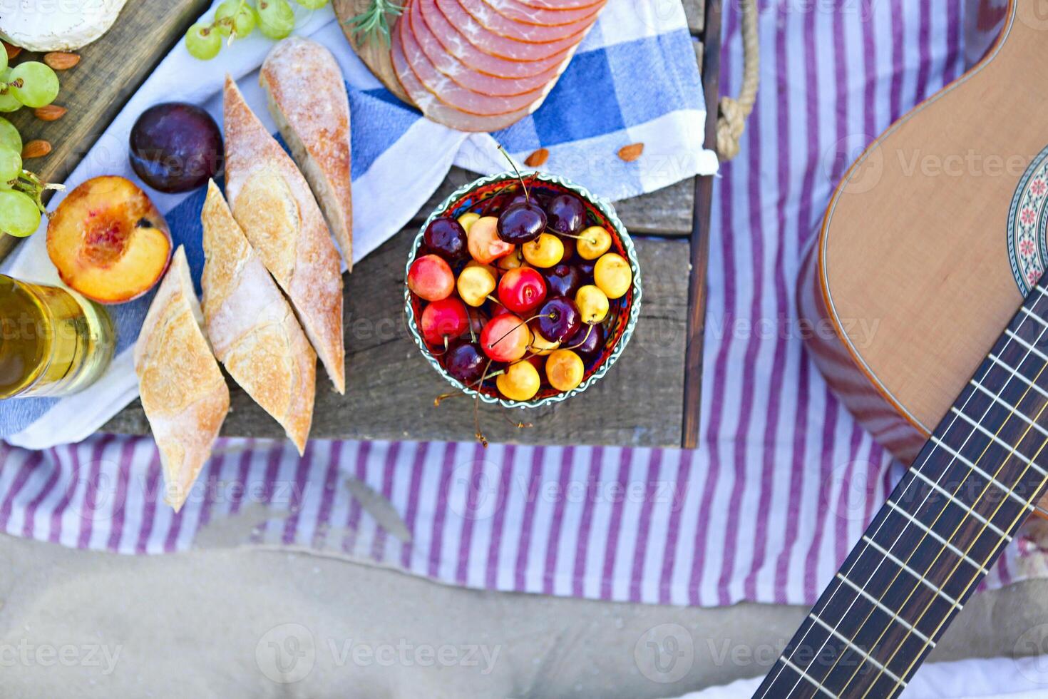 Picnic on the beach at sunset in the style of boho photo