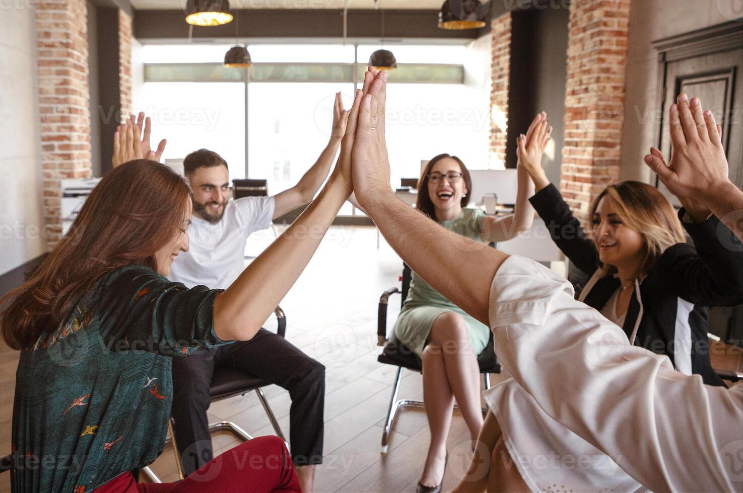 Office workers celebrating project finish photo