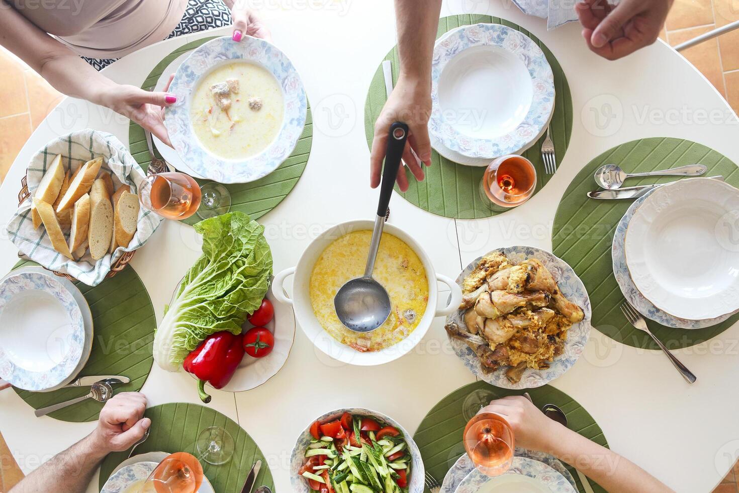 Close up of the table fish soup, salad and chicken photo