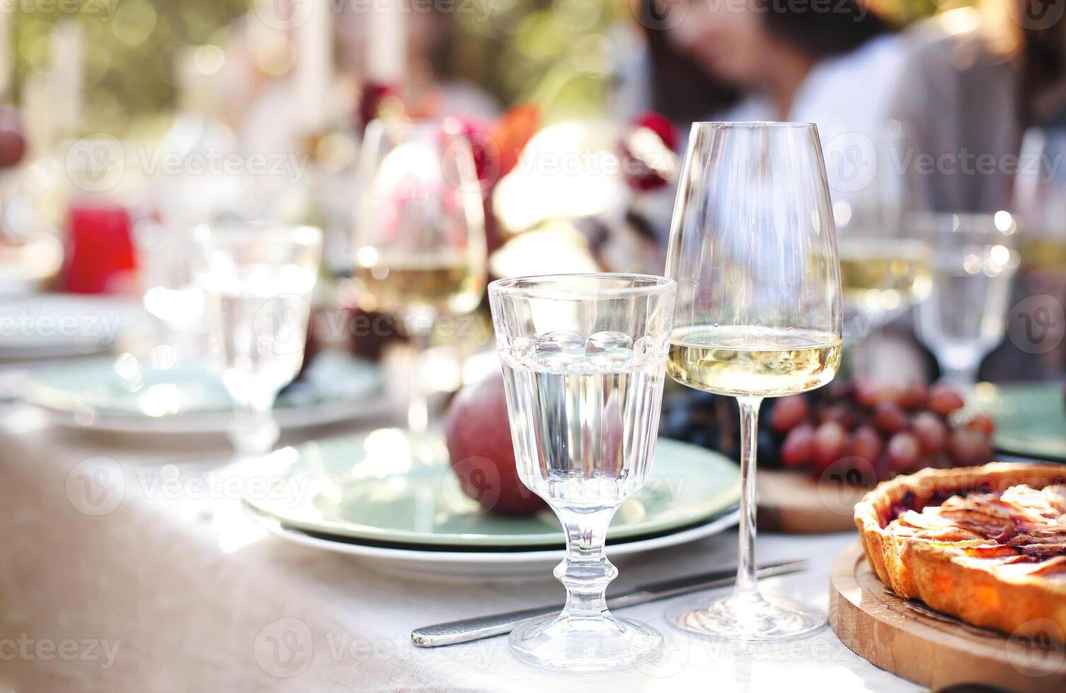 Candles and flowers on banquet table photo