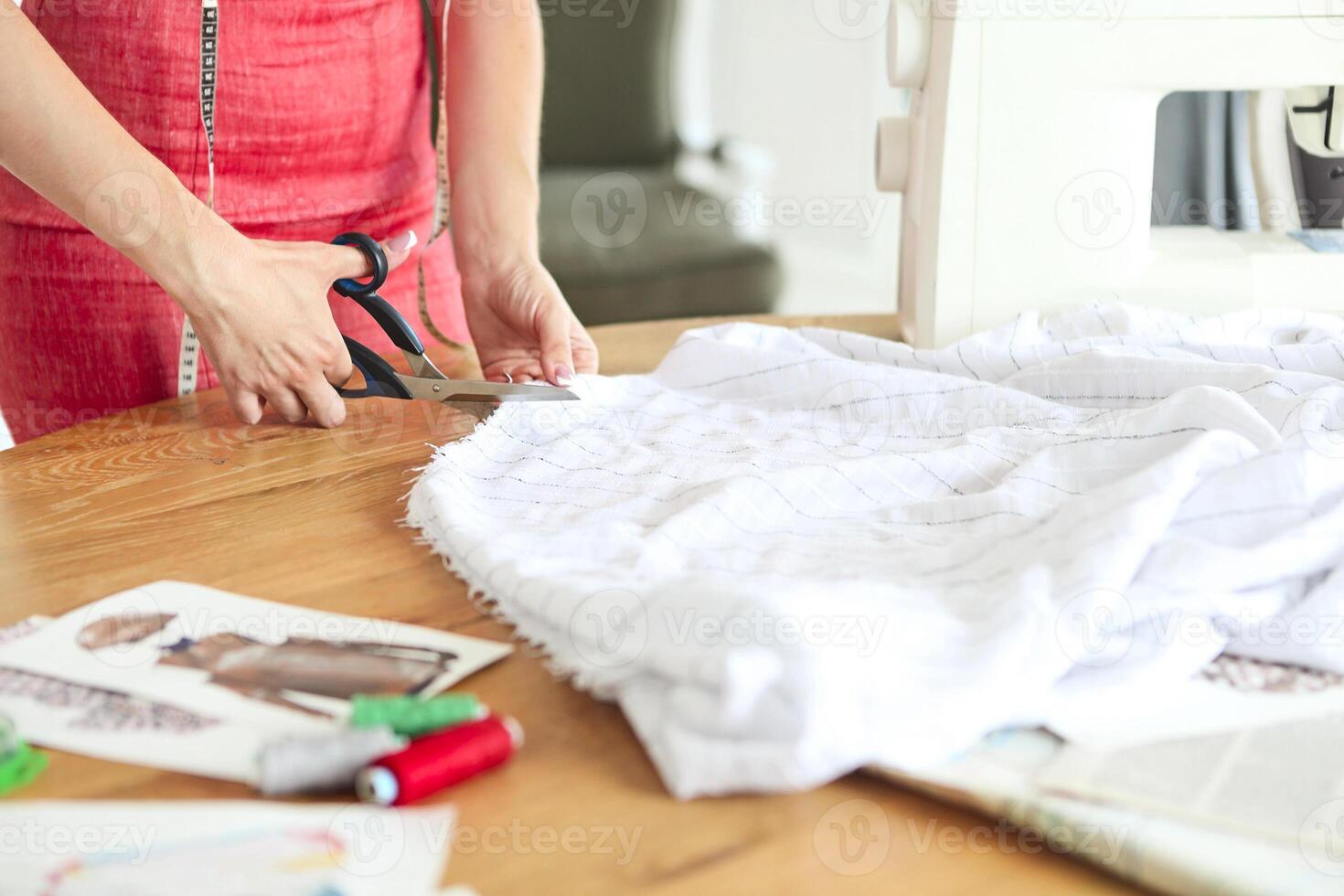 Fashion designer woman working on her designs in the studio photo