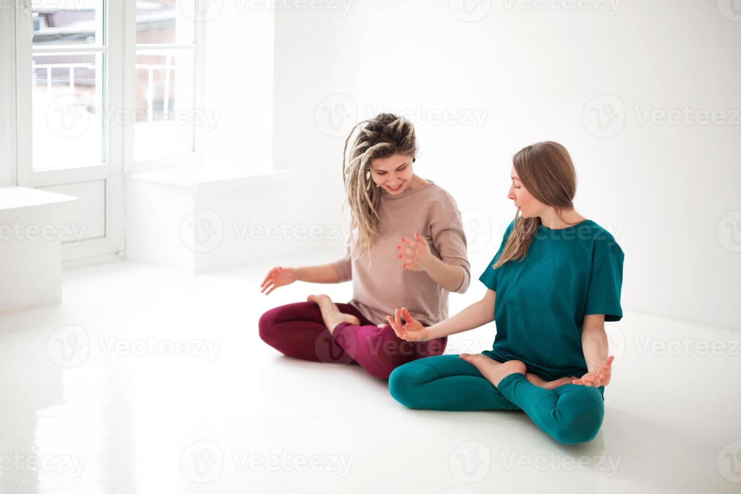 Women practicing yoga at home photo
