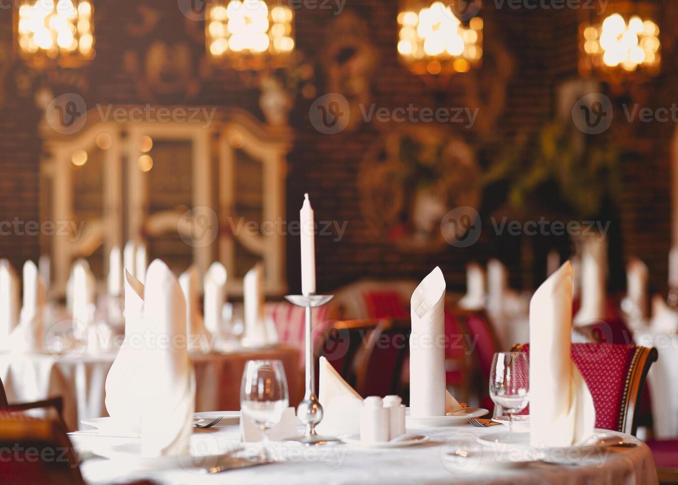 Festive table with candles in luxury restaurant photo