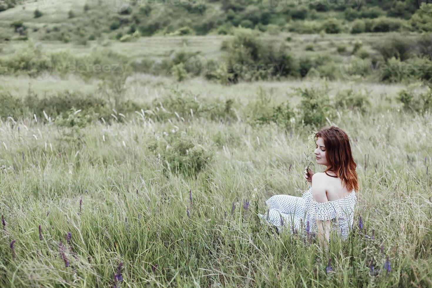 Young woman resting in countryside photo