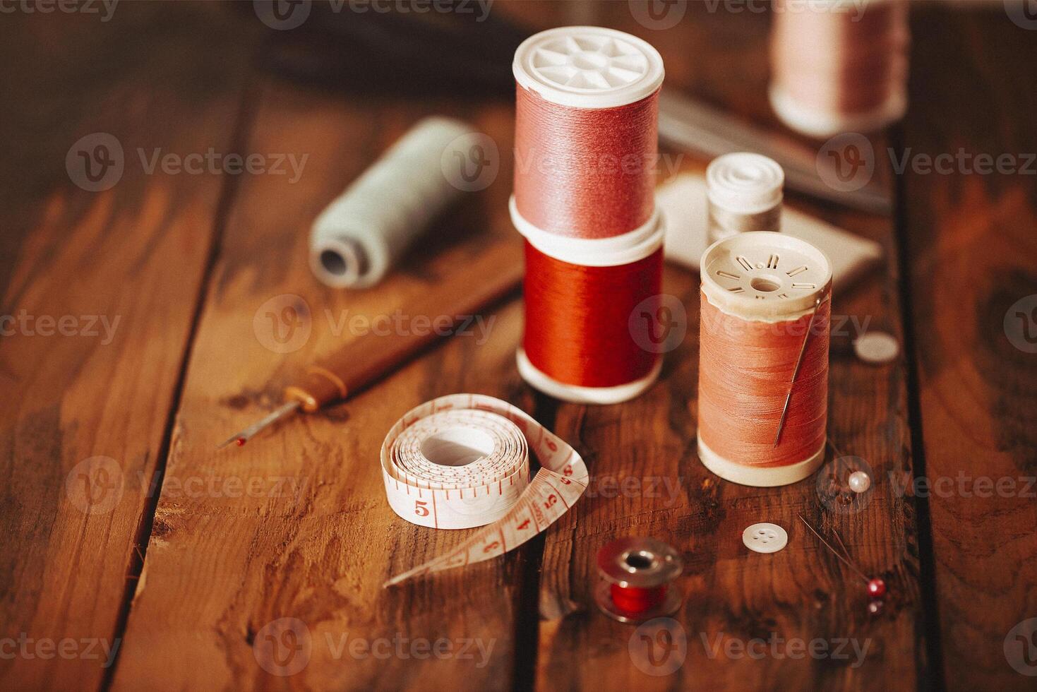 Sewing supplies on wooden table photo